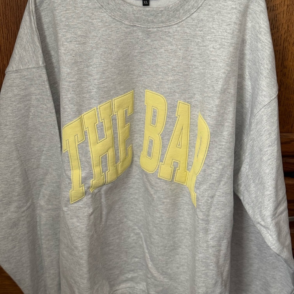 The Bar Light Gray Sweatshirt with Yellow Accents